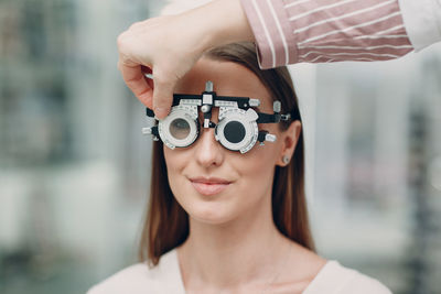 Portrait of woman wearing eye test equipment