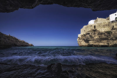 Beautiful view of polignano a mare from the beach cave, a paradise.