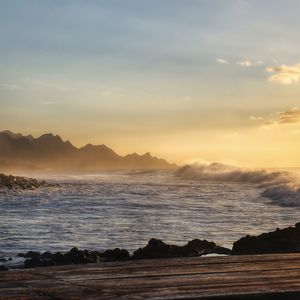 Scenic view of sea against sky during sunset