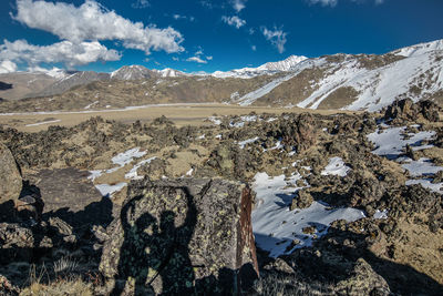 Scenic view of snowcapped mountains against sky