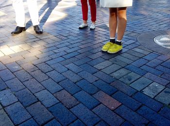 Low section of man standing on street