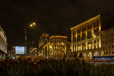 Illuminated buildings in city at night