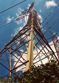 Low angle view of ferris wheel against sky