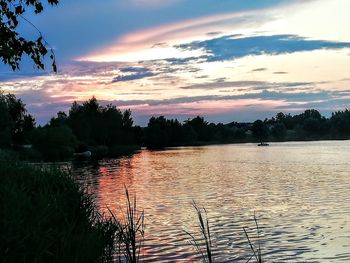 Scenic view of lake against sky during sunset