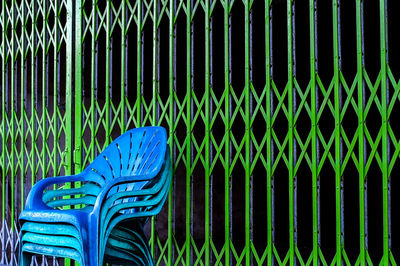 Close-up of blue plastic chairs