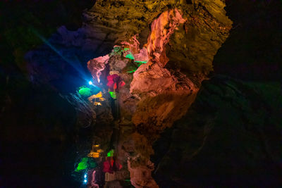 Low angle view of rock formations at night