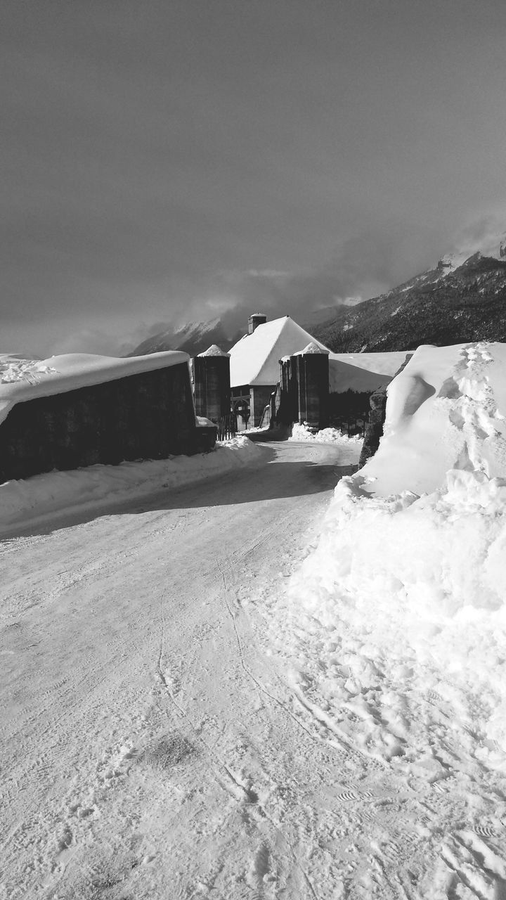 building exterior, architecture, built structure, snow, house, winter, mountain, cold temperature, residential structure, weather, landscape, sky, residential building, season, clear sky, nature, road, outdoors, town, village