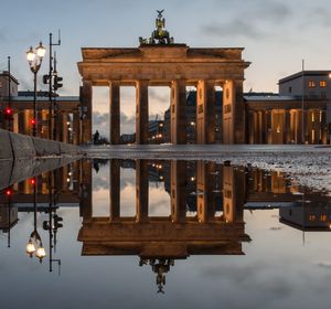 Reflection of illuminated building in water