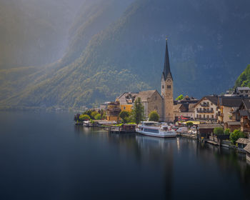 Panoramic view of lake and buildings against sky