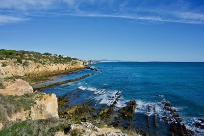 Scenic view of sea against blue sky