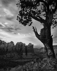 Rock formations on landscape against sky