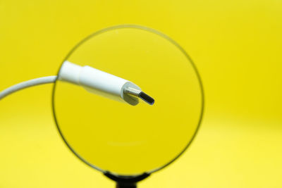Close-up of yellow light bulb