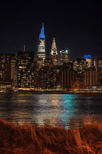 Illuminated buildings in city at night