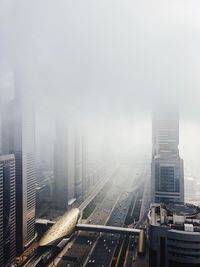 Aerial view of cityscape in foggy weather