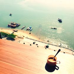High angle view of coffee on beach