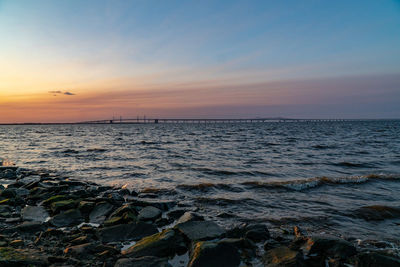 Scenic view of sea against sky during sunset