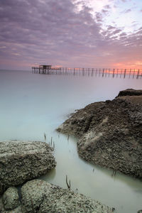 Scenic view of sea against sky at sunset