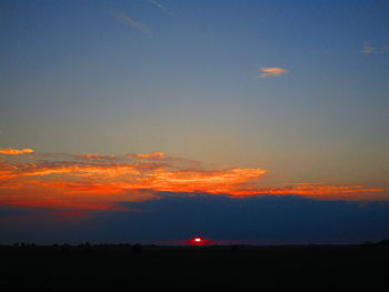 Scenic view of silhouette landscape against sky during sunset