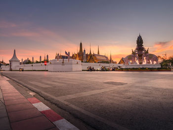 View of buildings against sky at sunset