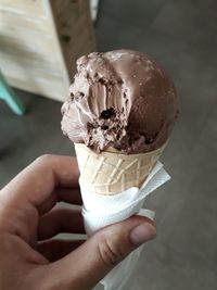 Hand holding ice cream cone