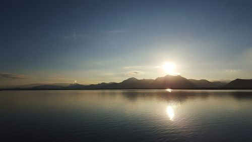 Scenic view of lake at sunset