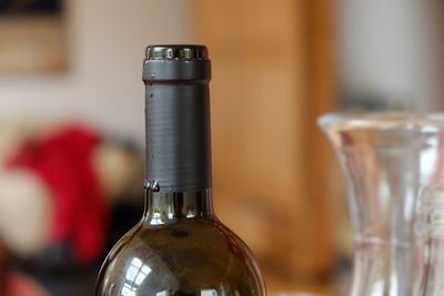 Close-up of wine bottles on table