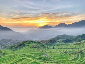 Scenic view of landscape against sky during sunset