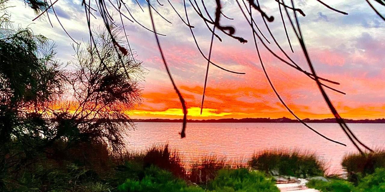 SCENIC VIEW OF LAKE DURING SUNSET