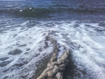 High angle view of surf on beach