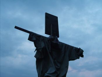 Low angle view of statue against sky