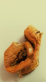 Close-up of bread against white background