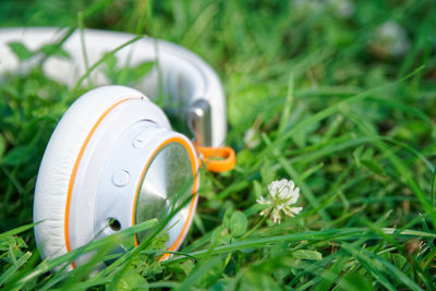 Close-up of white headphones on field