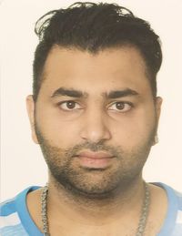 Close-up portrait of young man against white background