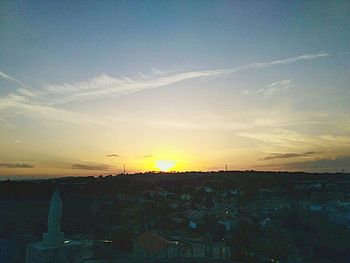 Cityscape against sky during sunset