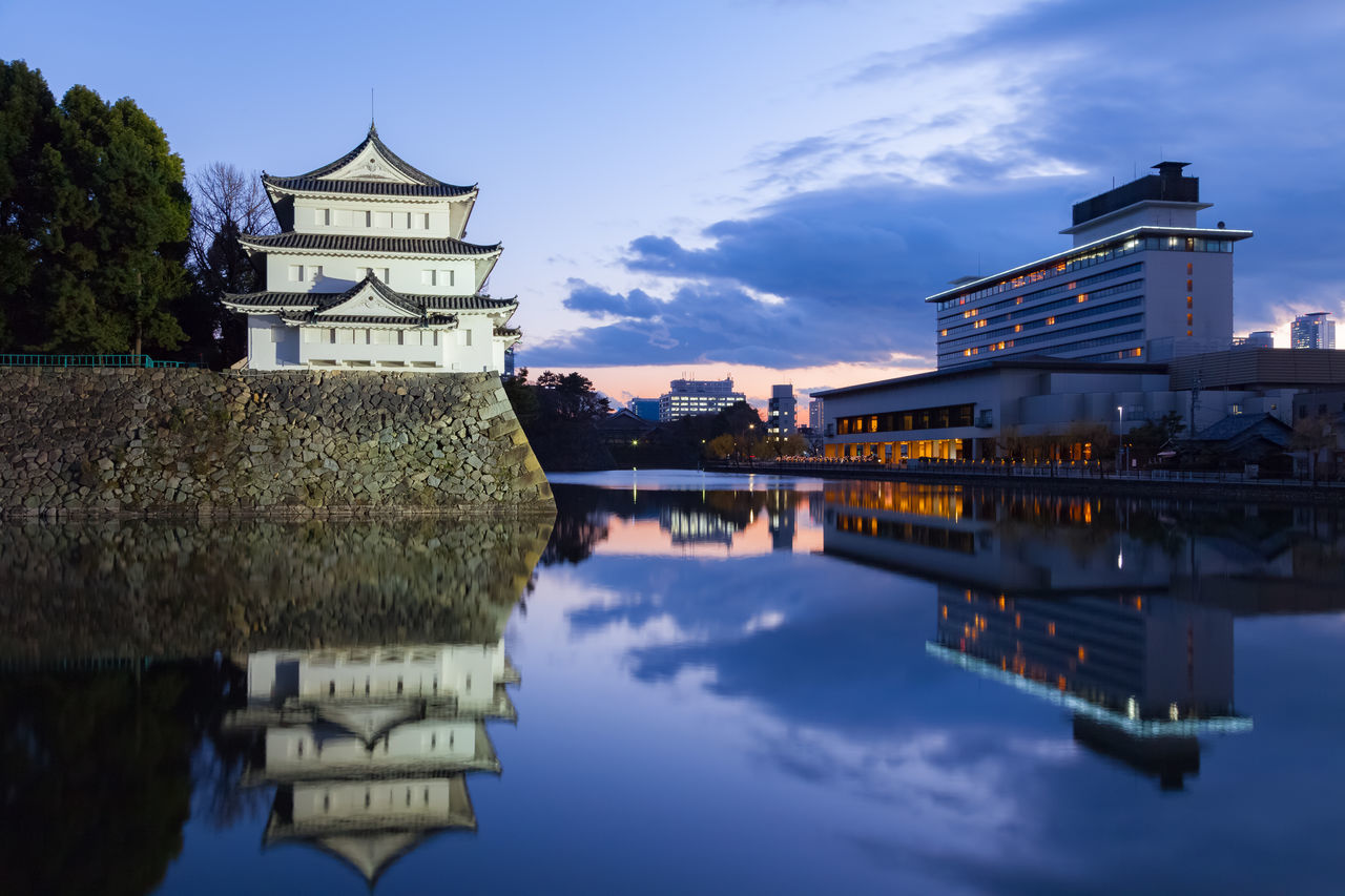 architecture, built structure, building exterior, reflection, water, sky, waterfront, cloud - sky, standing water, lake, tree, river, place of worship, cloud, religion, history, outdoors, travel destinations, day, canal