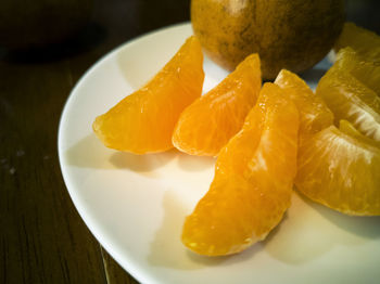 High angle view of fruits in plate on table