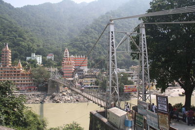 High angle view of buildings and trees in city