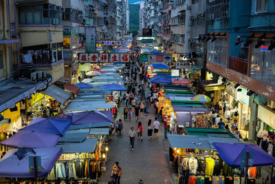 High angle view of people walking on street market