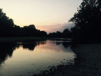 Scenic view of lake at sunset