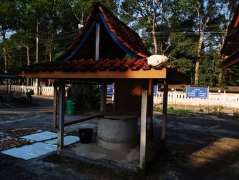 Gazebo in park by building in city
