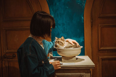 Midsection of woman holding food at home
