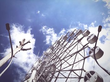 Low angle view of rollercoaster against sky