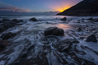 Scenic view of sea against sky during sunset