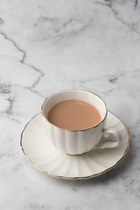 High angle view of coffee cup on table