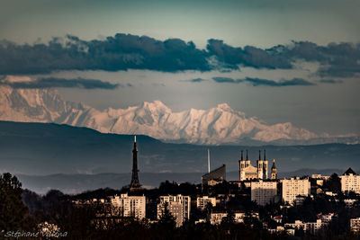 High angle view of buildings and mountains against sky