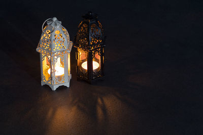 Close-up of illuminated lantern in the dark