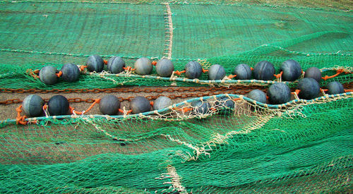 High angle view of fishing net on shore