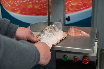 Close-up of man preparing food