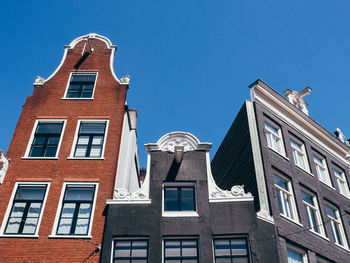 Low angle view of building against blue sky