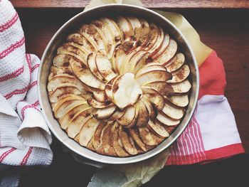 Directly above shot of apple cake in container on table